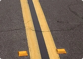 Freshly painted asphalt striping on a cement road